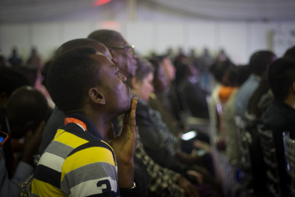 A man in the crowd listens to BULAWAYO Provincial Affairs minister Eunice Sandi Moyo as she presents her speech